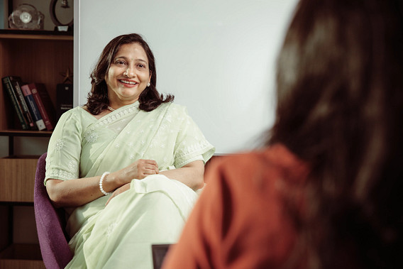 Smiling woman sat in a chair
