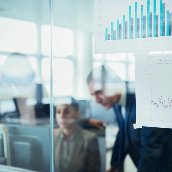 obscured view of office workers through the window