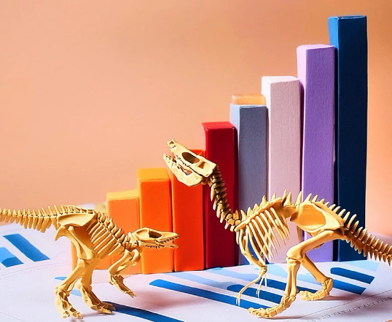two dinosaur skeletons posed in front of a colorful bar graph