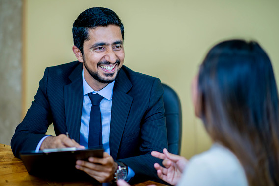 Indian businessperson talking to colleague